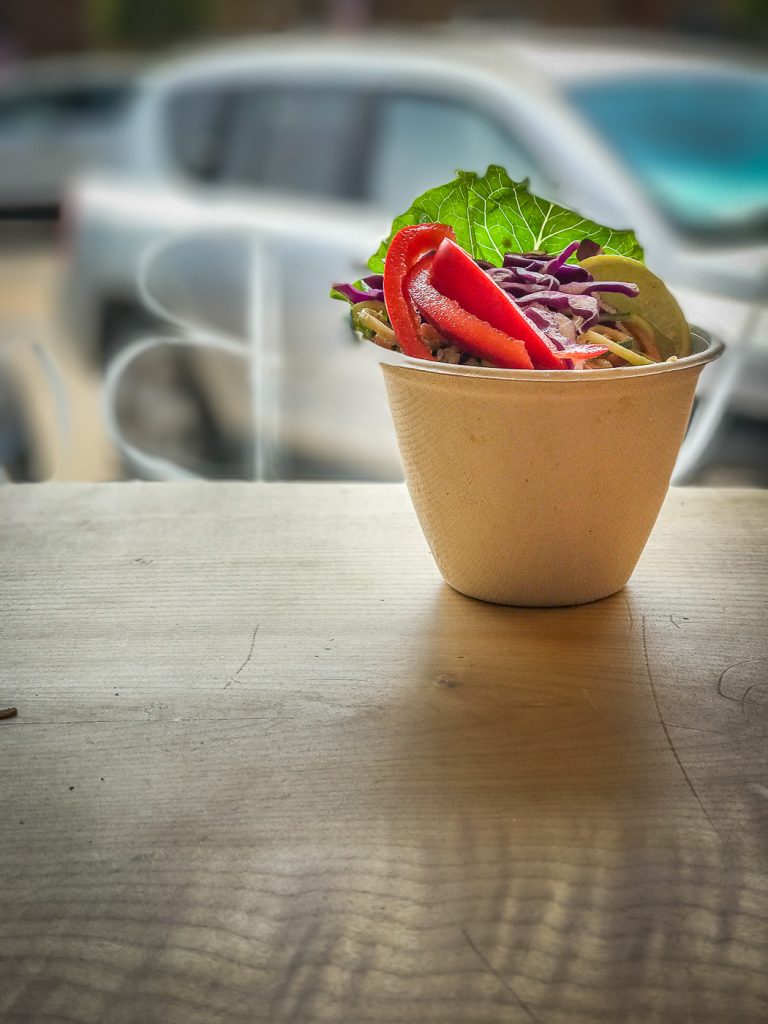 A small bowl filled with colorful vegetables