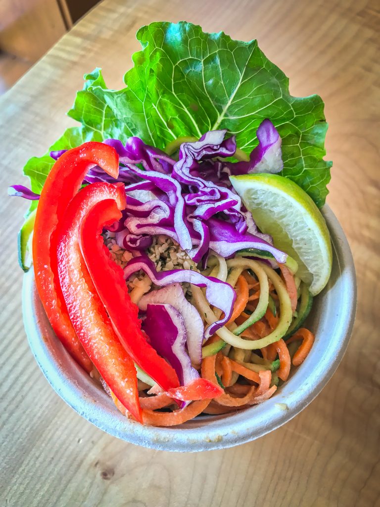 A small bowl filled with colorful vegetables