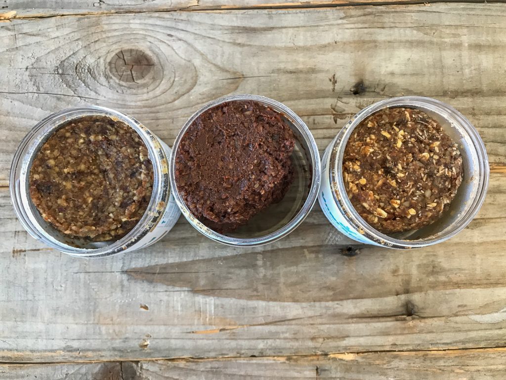 Three jars from the top of Unwrapp'd nutrition bar dough