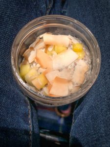 Container of Coconut Chia Pudding on lap