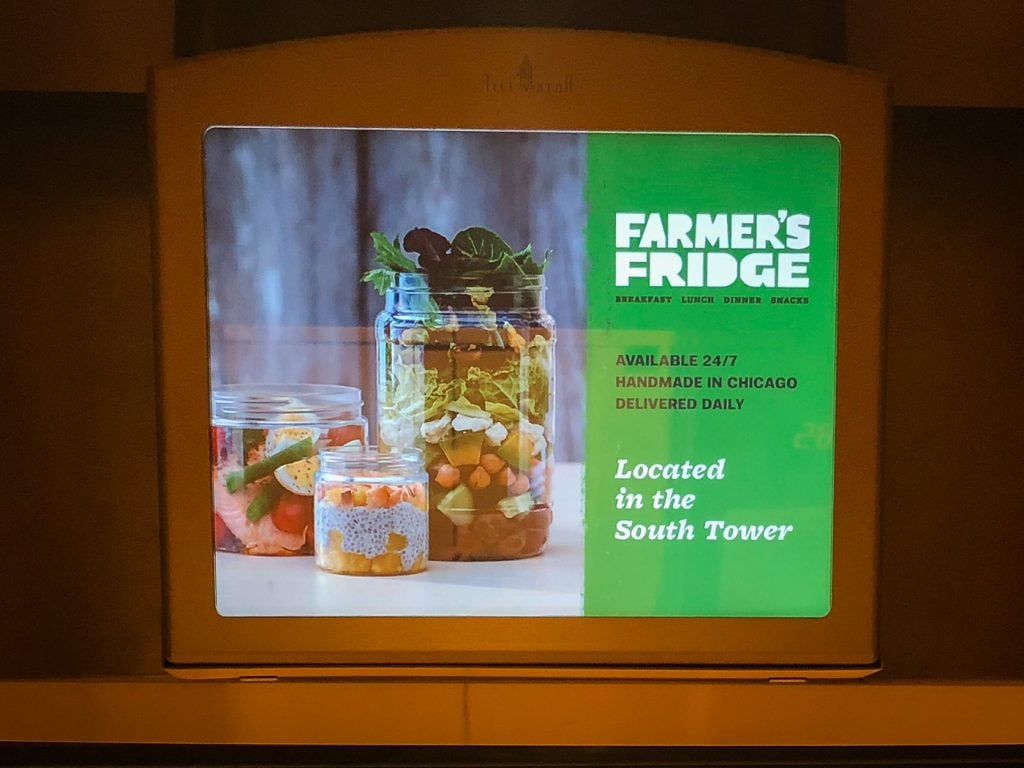 Video screen in elevator showing ad for Farmer's Fridge