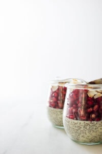 Two jars filled with pudding and fruit