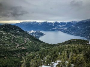 View of Howe Sound surrounded by mountains and trees