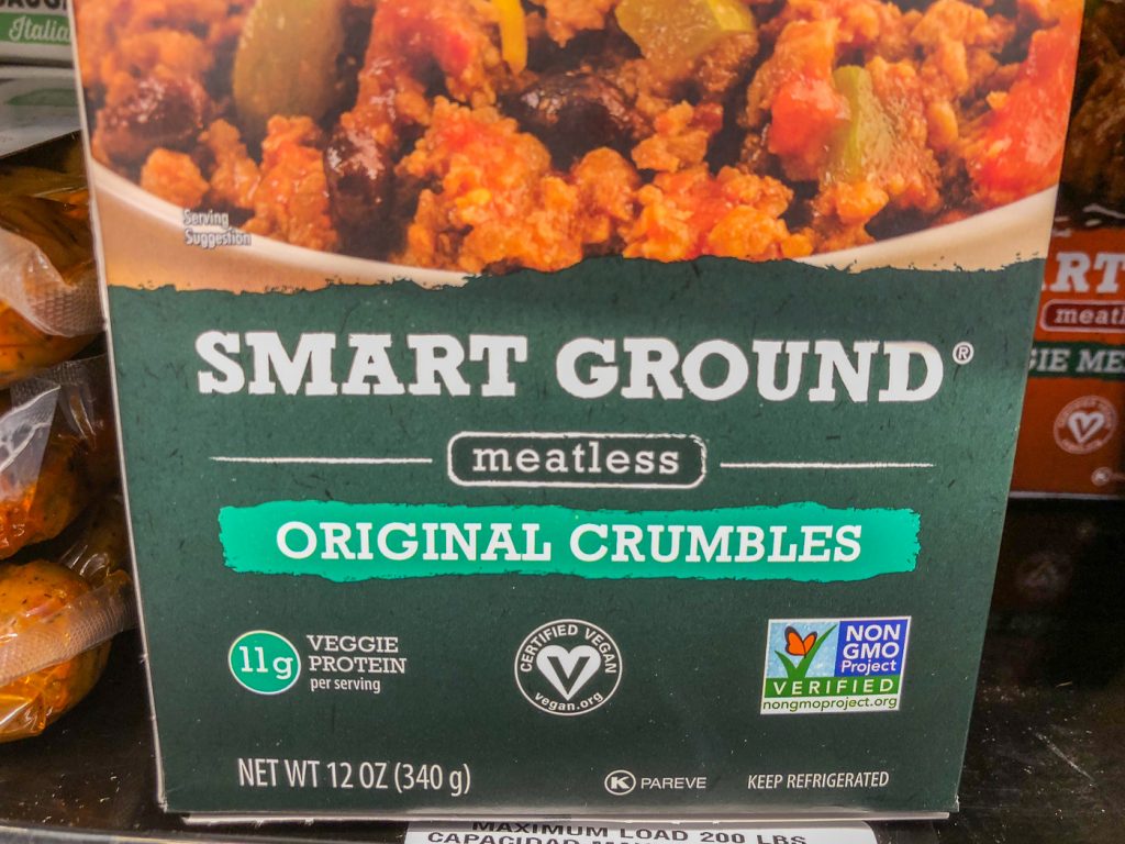 Close up of a vegan stamp/symbol on a package of meatless burger crumbles