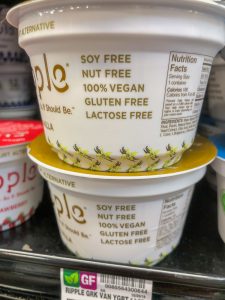 Close up of a yogurt container labeled 100% vegan