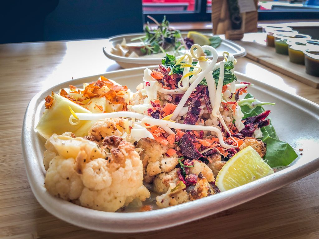 Bowl of rice, cauliflower, shredded carrot, pineapple and bean sprouts