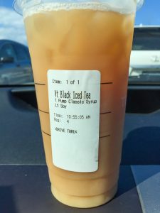 Starbucks cup on dashboard