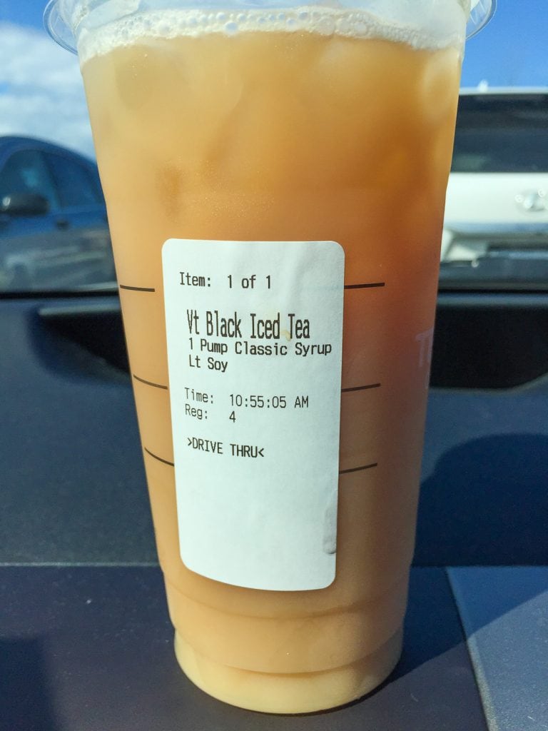 Starbucks cup on dashboard 