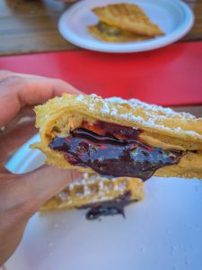 Close up of a chocolate and peanut butter filled waffle