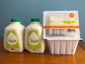 Two cartons of soymilk and two packages of tofu