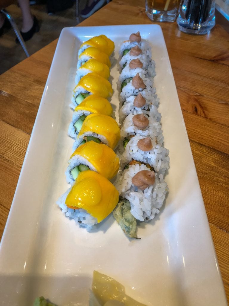 Oblong plate filled with sushi rolls