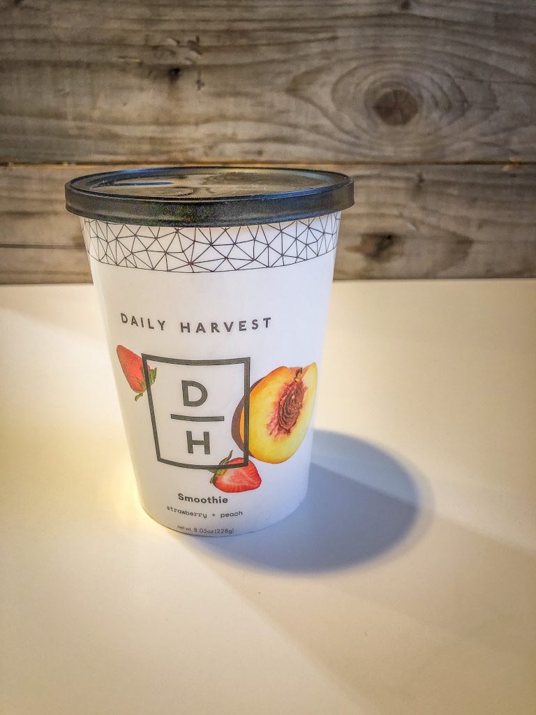 Paper cup with smoothie inside