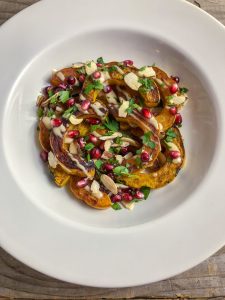 Delicata Squash with pomegranate, parsley and almonds