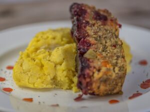 slice of lentil loaf with mashed potatoes