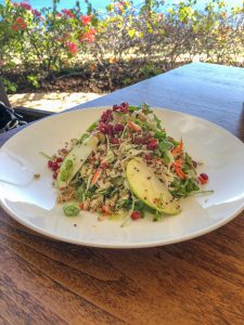 Bowl full of fruit and vegetable salad