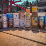 Cans of iced coffee on a picnic table