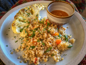 Couscous, cauliflower on plate