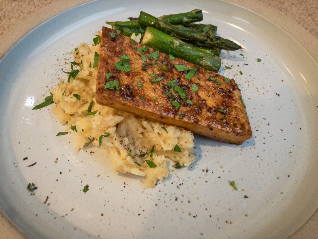 Plate with tofu, mashed potatoes, and asparagus