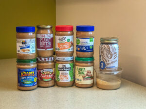 10 jars of peanut butter stacked