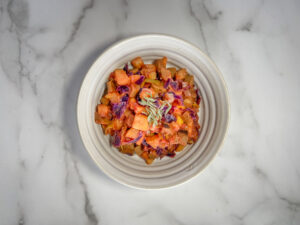 Top down shot of bowl of colorful vegetables and potaotes