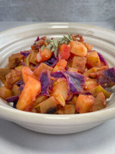 Close up of bowl of veggies and sausage