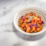 Bowl of cooked veggies and apples