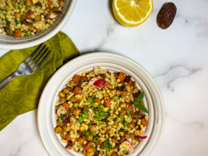 Top down pic of a bowl of couscous and vegetables