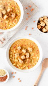 Top down view of two bowls of corn chowder