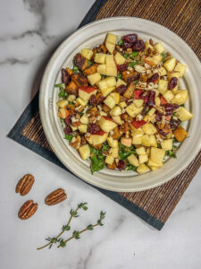 Top down bowl of veggies and apple