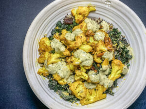 Top down view of bowl with cauliflower and veggies