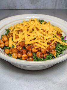 Bowl of chickpeas, greens and cheese