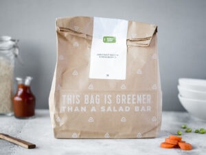 Paper sack next to bowls and jars