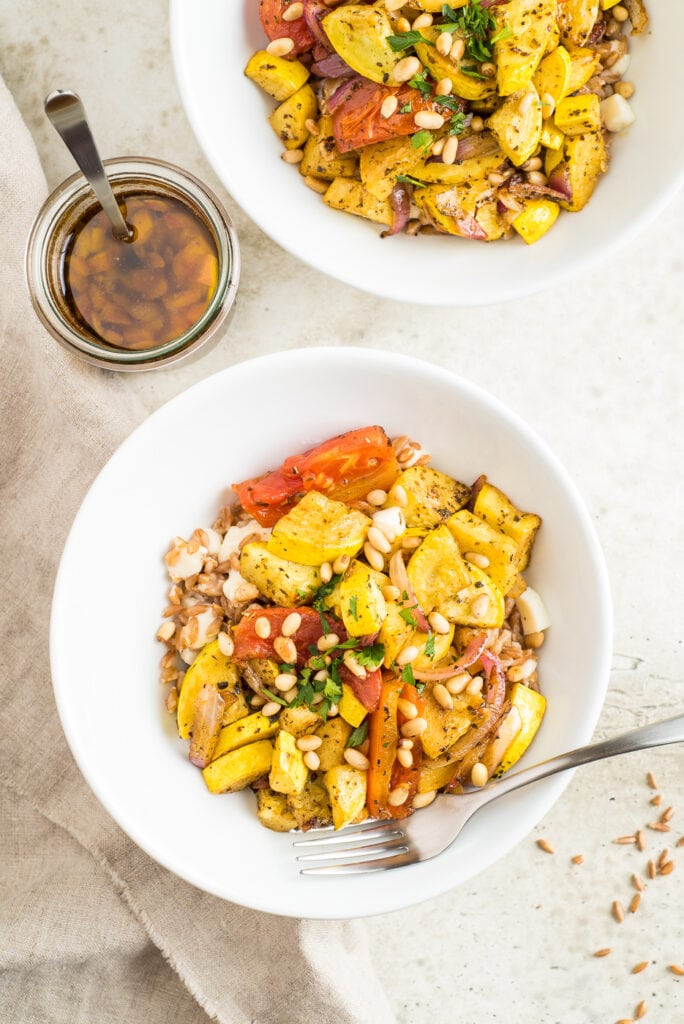 Two bowls of roasted veggies