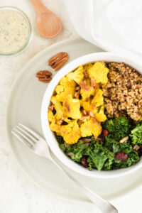 Top down view of bowl with veggies and quinoa