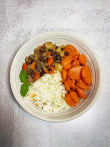 Top down bowl of beans, carrots and rice