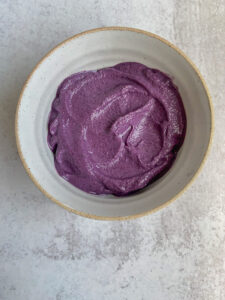 Bowl of bright purple smoothie