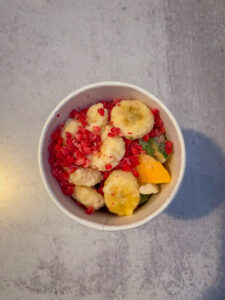 Cup full of frozen fruit and veggies