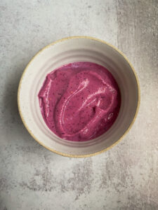 Bright pink smoothie in a bowl