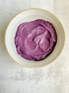 Bowl of bright purple smoothie