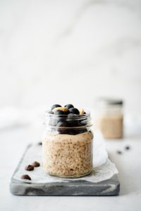 Small jar of chia pudding topped with blueberries
