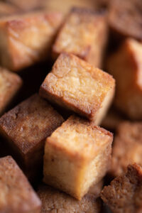 Close up of baked cubes of tofu
