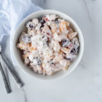 Top down view of large bowl of creamy fruit salad