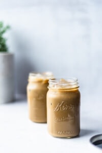 Two mason jars filled with molasses flavored milk