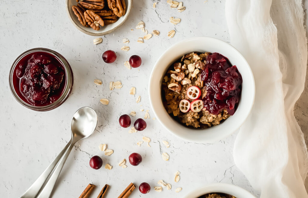 Top down view of bowls of hot cereal with cranberries