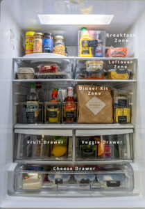 LG refrigerator full of food with some sections labeled