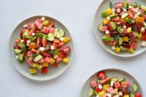 Top down of 3 plates filled with colorful vegetable salad