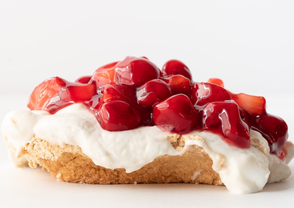Meringue dessert topped with cherries