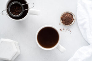 Top down view of two cups of cacao tea