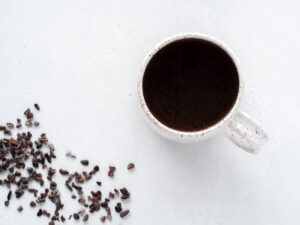 Top down view of white mug of cocoa nib tea