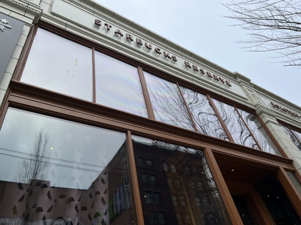 Windows and sign on front of Seattle Starbucks Roastery